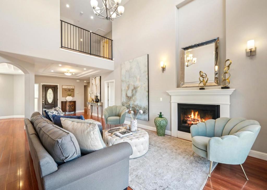 Welcome to this impeccably cared for, young home built in 2019. Boasting high ceilings and a thoughtful layout, this residence offers 4 spacious bedrooms, including a master suite on each floor for ultimate convenience and flexibility. With 3 1/2 bathrooms and walk-in closets, there's no shortage of comfort and storage. Spacious 2-car garage with EV charger. An extra-long driveway offers more parking. Enjoy modern efficiencies 2 A/C units, 2 furnaces, and 2 tankless water heaters, ensuring comfort and endless hot water. The bedroom offers stunning mountain views The backyard offers fantastic space perfect for planting vegetable garden. Curb appeal abounds with a lovingly maintained garden adorning the front of the home. Sprinkler system in both the front and back yards makes for easy landscaping maintenance. No HOA! This home offers an unparalleled blend of comfort, convenience, and location. Commuters will love its prime spot between the Dumbarton and San Mateo Bridges, with easy highway access & South Hayward Bart. You'll be minutes away from retailers Costco, Trader Joe's, and Home Depot, Saturday farmers market, and Garin State Park, which provides fantastic hiking. This home truly offers an unparalleled blend of comfort, convenience, and location. Don't miss this gem!