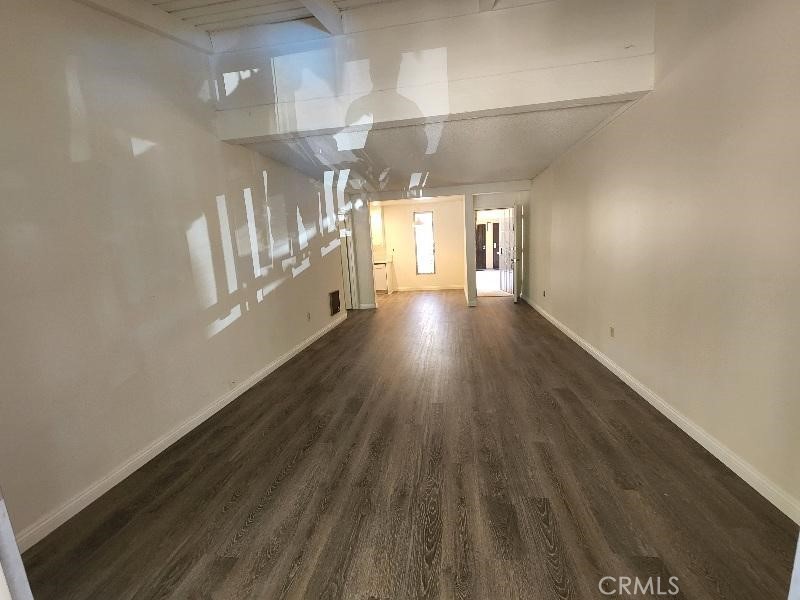 Model Like Remodeled South Coast Metro Area One Bedroom Condo in the Macarthur Village community . Features include ; Choice Upper Location with nice view of the neighborhood , Hardwood Style Vinyl Plank Flooring throughout , largest 1 bd floorplan in the community - aprx 740 sq ft , kitchen has white cabinets / stainless electric range / white quartz counters / dw , bath has a tiled walk in shower with bench & frameless door , bedroom has a walk in closet , living room has vaulted ceilings & balcony , dining area , parking consists of one carport with storage locker / 2 nd car unassigned uncovered space , gas / water / trash / gardener / sewer paid , ac / heat , 24 hour guard gated Macarthur Village community offers pickleball / 5 pools & spa areas / laundry rooms / 4 tennis courts / gym / clubhouse / barbeque & picnic areas / basketball court . One block to South Coast Plaza / Segerstrom Center / movies / coffee shops / world class fine dining & shopping , close to the 405 / 55 / 73 / & 5 freeways / John Wayne Airport , short drive to Newport & Huntington beaches