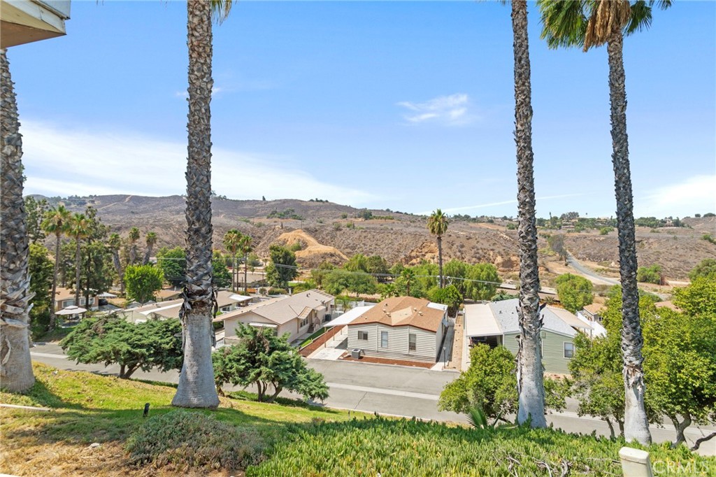 Welcome Home To This Wonderful "Diamond In The Rough" Home In The Highly Desirable Rancho Caballero Mobile Home Park And All It Has to Offer, Overlooking The Infamous Mockingbird Canyon* This Home Features Over 1400 Sq Ft Of Living Space With 2 Generous Sized Bedrooms With Walk In Closets, An Ample Sized Bonus Room/Office With Built In Cabinets And A Wet Bar, A Separate Dining Room With Built In Cabinets, A Kitchen With An Island Stove And Plenty Of Cabinets, And A Living Room Looking Out To Those Spectacular Views, And Just In Time For Holiday Entertaining* This Home Also Has A Newer Water Heater, A Ramp For Wheelchair Convenience, Central AC In Addition To The Accommodating Swamp Cooler And Was Recently Retrofitted Under The Home For Earthquake Safety. Rancho Caballero Is One Of Riverside's Most Sought After Family Communities With It's Resort Style Amenities Galore To Include Swimming Pools, Including A Children's Pool, Spa, A Basketball Court, A Baseball Field, BBQ Areas, Lighted Tennis Courts, A Wonderful Dog Park For Fido, Playgrounds, A Fitness Center, Billiard Room, A Clubhouse And So Much More* All Of This AND It's Close To The Freeways And Walking Distance To The Public School Bus Stop* With Some Elbow Grease And TLC, You Can Make This Diamond In The Rough Your Dream Home* Bring Your Family To See This Home Before It's Gone!