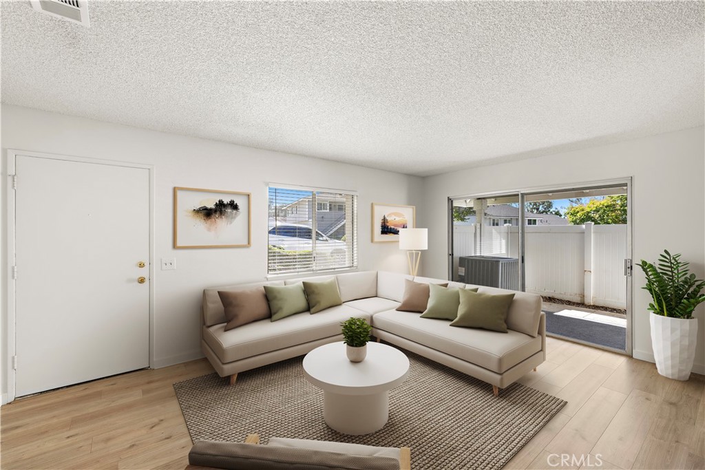 Welcome to the best in Fullerton living! This beautifully updated single-level two-bedroom home in the heart of Fullerton. Fresh paint and laminate flooring throughout create a modern, turnkey personality. The kitchen features quartz countertops and a classic subway tile backsplash, complemented by updated hardware. The bathroom includes a new vanity with quartz countertop for a fresh, clean look. Live in comfort with newer heating and air conditioning. A private patio with vinyl fencing offers the perfect space to relax or entertain. Convenient indoor laundry and direct access to a two-car garage complete this well-maintained home. Ideally located near top-rated Fullerton schools, parks, trails, shopping, dining, and freeways.