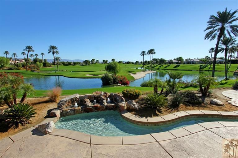 Huge lot at end of cul-de-sac with really awesome views across the driving range, multiple fairways and lakes, the spectacular 18th hole, and the clubhouse. And a gigantic side yard with a putting green! The court entry leads you into a soaring 18', skylit rotunda foyer that opens up to BIG a big 43' Great Room, a big 17' Office/Den, a big 35' Master Suite over 4400 sf. of spacious luxury. Guests?...a courtyard casita plus two guest rooms with their own sitting room (or media room or family room). The Great Room with its bow-window dining room captures the view and is perfect for entertaining. Outside the lush landscaping, custom pool & stream, and the huge side yard extend the entertaining and frame the view. Magnificent fireplaces, gourmet kitchen with European-style maple cabinets, slab granite counters, built-in fridge; switch-start fireplace, Roman tub in master bath.