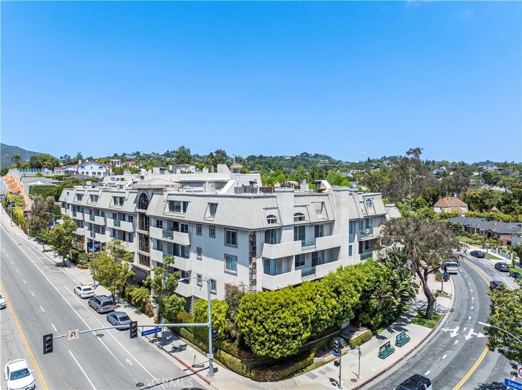 Immaculate two bedroom, two bath condo in the incredible Montana Regency located in prime Westside where S. Bel Air, Brentwood & Westwood meet. Brand new wide plank laminate flooring throughout. The light-filled living, dining and kitchen areas comprise the large open floor plan with a beautiful corner fireplace and large sliding doors. The updated Kitchen features Quartz counter tops, high-end stainless steel appliances, plenty of cabinet and counter space and a breakfast bar. Primary bedroom has en-suite bath with dual vanity, hall closet as well as a large walk in closet. The 2nd bedroom is located on the opposite side of the unit with its own walk in closet and bath. Stackable washer/dryer in unit. Located on Floor 1 - one level above the street in this building with easy access to the pool, sauna, newly refurbished gym, racquetball court and party/rec room. Two cars garage parking included along with 12 guest parking spots. Unbeatable location close to UCLA, Brentwood, Bel-Air and Century City. Condos in this building rarely come on the market!