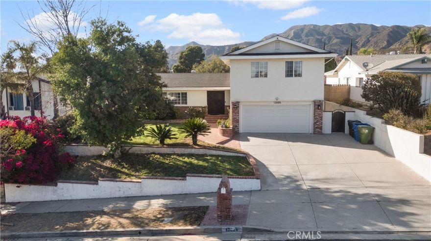 Welcome to this stunning two-story residence offering the perfect blend of comfort, style, and modern upgrades. Upstairs features: 4 spacious bedrooms including a luxurious master suite with a private full bathroom and balcony overlooking the backyard and breathtaking mountain views. An additional remodeled full bathroom upstairs for convenience. Downstairs features: fully remodeled kitchen with modern finishes, designed for both everyday living and entertaining. A remodeled full bathroom with a spacious closet. A versatile bonus room that can serve as an office, gym, or guest space.

Recent upgrades include a BRAND-NEW ROOF, NEW air conditioning system, newly remodeled pool with elegant pebble finish and new pool equipment.