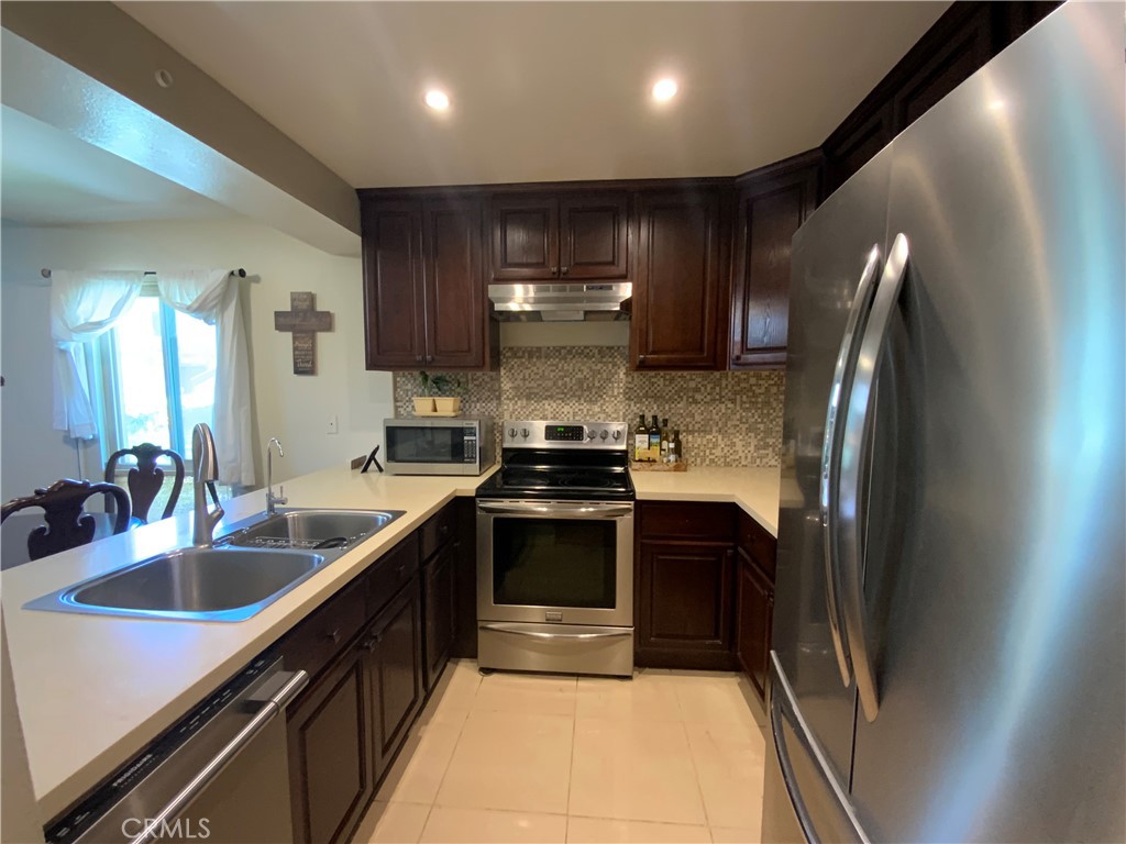 Beautiful updated condominium, located in the Highly Parkside Gated Community of Hawaiian Gardens.
This 2 Story Condominium features 2 spacious Bedrooms, 2 Bathrooms and 2 attached Car Garage, extra non assigned parking spaces maybe available. First level main entrance to a spacious open floor plan living room, with vaulted ceilings a beautiful updated Kitchen cabinets, stainless range, dishwasher and sink, large pantry, dining room, a balcony for relax and enjoy a BBQ, and the most wanted is one Large Bedroom and one Bathroom all of this is in the first level.
Second level wood stairs, One Large Bedroom with balcony, one Bathroom, laundry room, and a Large Loft that it may be can easily transform into a 3rd Bedroom, For a larger family or expecting.
Monthly HOA includes: Fire Insurance, Water, Trash and maintenance. This Complex features 2 Swimming Pools, 2 Spa's, and 2 Tennis Courts.
Close by 605, 91, and 405 freeways, shopping centers and more. ABC School District