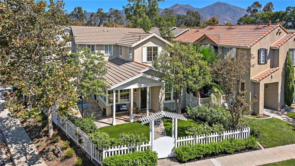 Welcome to 1 Paseo Vecino, an exceptional 3 bedroom, 3 bathroom residence tucked inside the highly sought-after gated community of Los Paseos in central Rancho Santa Margarita. Offering one of the best locations in the neighborhood, this home enjoys only one adjacent neighbor and a lush green park directly in front, creating a rare sense of privacy and openness.
The interior features a remodeled kitchen with brand-new Samsung appliances, updated cabinetry, quartz counters and modern finishes that flow seamlessly into the dining and living spaces. A cozy family room with a fireplace provides the perfect gathering spot.
This floor plan is both functional and versatile, highlighted by two spacious primary suites, upstairs laundry and a main-level bedroom with a full bathroom, ideal for guests, multigenerational living, or a home office.
Outdoors, the private porch and yard is perfect for dining al fresco, entertaining, or simply relaxing. As part of the gated Los Paseos community, residents enjoy exclusive amenities including a pool, spa, outdoor showers, BBQ area and a large grassy park—all while also having access to Rancho Santa Margarita’s lake, beach club, parks, sports courts, and award-winning schools. With its central location, stylish upgrades, and unmatched setting, 1 Paseo Vecino presents a rare opportunity to live within walking distance to all that RSM has to offer.