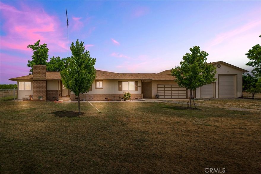 Welcome to your 15-acre retreat at the end of Dayton West Road, where privacy, productivity, and peaceful living all come together. Bordered by six-year-old almond trees already in production, this property isn’t just a home, it’s a lifestyle and an investment rolled into one. The orchard is under a maintenance lease, giving you the benefit of annual income without the day-to-day work. Add in the fully equipped guest suite, with its own kitchen and bathroom, that’s perfect for extended family, visitors, or as a rental, and you have two income-producing opportunities right on site. The main home is a cozy 3-bedroom, 2-bathroom residence with an additional office. Inside, natural light floods through dual-pane picture windows, framing breathtaking sunsets over the rice fields and valley beyond. A wood stove adds warmth and charm in the cooler months, while a screened-in porch provides the perfect place to unwind on summer evenings. For those who love projects or need space to spread out, this property truly delivers. A 25’x30’ RV garage provides secure storage, and a massive 2,000+ sq. ft. workshop, designed with sturdy 6-inch walls, gas and compressor lines, custom storage racks, and hoists, everything you need for woodworking, metalwork, or even running a home-based business. Three towering 18’ grain silos add even more storage potential. Around the homesite, you’ll discover a bounty of nature’s gifts: fruit, citrus, and nut trees ready to enjoy, plus a pecan tree offering shady afternoons. A fenced yard, mature shade trees, and thoughtfully placed garden beds add to the welcoming country feel. With both a domestic well and a high-producing ag well, water is never in short supply. And yet, despite the privacy and wide-open feel, you’re just 10 minutes from Durham, Chico, and the Sacramento River. Whether it’s running errands, enjoying a night out, or escaping to the river for fishing or kayaking, everything you need is close at hand. Here, you can wake to the sounds of waterfowl, watch bunnies dart through the orchard, and end the day with unforgettable sunsets. Whether you dream of farming, need space for projects, or simply want a tranquil retreat with built-in income opportunities, this 15-acre farm offers it all.