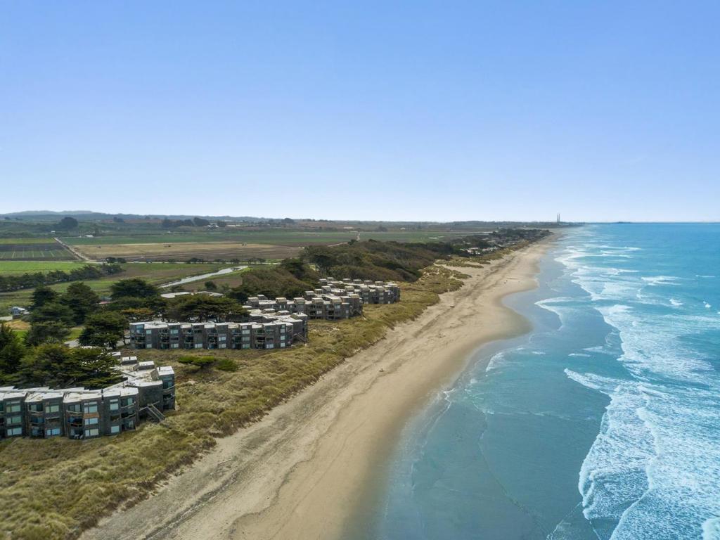 Welcome to your coastal escape in Pajaro Dunes, a gated beachfront community nestled along the shores of Monterey Bay. This dreamy top-floor, end-unit condo features stunning ocean views and a unique layout designed for comfort and relaxation. With two bedrooms, two bathrooms, and 1,370 square feet of open living space, you'll enjoy soaring ceilings, spacious rooms, and a bright, airy atmosphere. The home includes a cozy fireplace, a built-in office area, generous closet space, an in-unit washer and dryer, and tasteful upgrades throughout. Step outside onto two private decks to soak in the fresh sea air and breathtaking views. Residents of Shorebirds enjoy a host of resort-style amenities, including athletic courts, pickleball, EV charging stations, a charming gift shop, and scenic nature trails that showcase the best of Monterey Bays natural beauty. Whether you're seeking a peaceful personal retreat or a desirable short-term rental, this beachside condo is the perfect fi t.Consider this your signits time to buy the beach house.