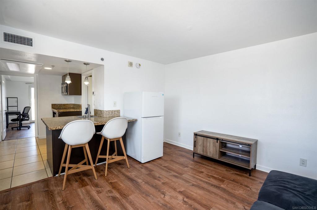 Step into urban convenience with a rare corner unit that gives you the privacy you crave—no shared walls, just peace and quiet in the heart of the city. Imagine stepping out your front door and being only two blocks from Walmart, making daily errands a breeze without ever needing your car. This light-filled condo offers a uniquely private layout that feels more like a standalone retreat than an apartment. Whether you're sipping morning coffee with no neighbors peeking in or strolling to shops and dining just minutes away, this home blends walkability with a sense of calm you won’t find anywhere else.