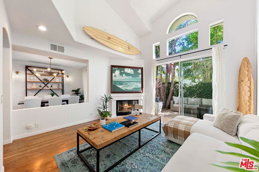 A tastefully updated 3-bedroom condo in The Pointe! This pristine two-level unit offers a perfect central location in one of Malibu's most desirable gated communities. A welcoming entryway opens up to a well-appointed layout with a light and bright interior and luxury finishes, including hardwood floors, recessed lighting, and new light fixtures. The living room features soaring ceilings, skylights, a gas fireplace, and outdoor access. A fully equipped kitchen offers Viking appliances, granite countertops, a breakfast bar, and seamlessly connects to the dining area. Sliding glass doors in the dining and living rooms lead out to a fully enclosed backyard patio with tropical landscaping, an al-fresco dining and seating area, and gated access to a tree-lined walkway. Upstairs, the primary suite boasts vaulted ceilings and flows out onto a sun-soaked private balcony with peaceful views of swaying palm trees. An en-suite bathroom features dual vanities, a shower, a deep soaking tub, and a walk-in closet. A hallway with plentiful built-in storage leads to two additional bedrooms, one with a walk-in closet, and an updated full bathroom. Additional features include an entry-level powder room, Nest thermostat, 2-car garage, and private driveway. The Pointe boasts some of Malibu's finest luxury amenities, and residents enjoy use of the community pool/spa, tennis court with lights and Pickleball lines, a fully-equipped gym, and meticulously landscaped grounds. Located moments from Point Dume, local markets, sandy beaches, highly-rated schools, and more!