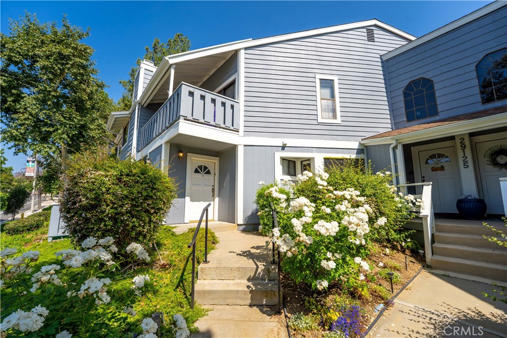 Welcome to this beautifully updated Meadow Ridge Home, a 2-bedroom, 2-bathroom condo offering 1,233 square feet of comfortable living in the heart of Agoura Hills. Freshly enhanced with new carpet, fresh paint, and modern window treatments, this home is move-in ready and radiates a bright, welcoming feel. The open-concept living and dining area features a cozy fireplace and sliding glass doors that invite natural light and flow seamlessly to a private balcony perfect for morning coffee or evening relaxation. The spacious kitchen provides ample cabinetry and countertop space, ideal for both everyday living and entertaining. Both bedrooms are generously sized, including a primary suite with a walk-in closet and en-suite bath for added privacy. The second bedroom and bath offer flexibility for guests, a home office, or personal retreat. Additional highlights include a private two-car garage, in-unit laundry, and central air/heat. The home is part of a well-maintained community with amenities such as a sparkling pool, spa, and lush greenbelts, offering both convenience and comfort. Ideally located near top-rated schools, shopping, dining, and easy freeway access, this condo combines style, updates, and location for an incredible opportunity to own in Agoura Hills.