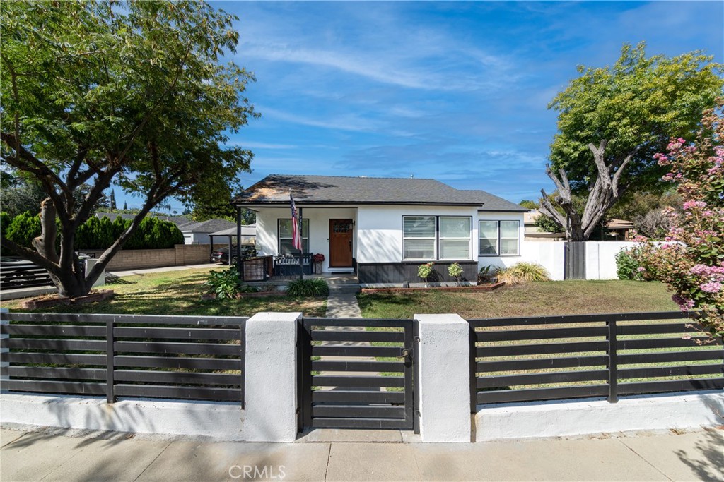 Welcome to your Reseda Cottage! This cozy 3-bedroom, 1-bathroom property has a large, gated front yard providing privacy along with remodeled upgrades! As you step through the front door, you'll be greeted by an inviting and spacious living area adorned with new porcelain tiled floors. The floor plan seamlessly moves from the living room to the dining area and kitchen, making it an ideal space for both relaxation and entertaining. The remodeled kitchen is a chef's delight, boasting beautiful stainless-steel appliances and new quartz countertops, providing ample space for meal preparation in addition to a spacious breakfast nook. The 3 bedrooms are spacious with an abundance of natural light, and one room has newly added French doors connecting to exterior sunroom. The bathroom has been tastefully remodeled, tiled floors and with brushed nickel fixtures. Stepping outside, you'll find your own private oasis in the backyard perfect for hosting barbecues under the gazebo or simply lounging in the sun on the recently landscaped pavers. RV length driveway with carport and detached garage perfect for ADU! Automatic sprinklers in front yard. Carport and backyard gazebo and two storage sheds stay. Additional upgrades include a new roof, newly serviced HVAC, new windows in living room, dining room and kitchen and an updated electrical panel. Quick access to the 101 and 405 freeways makes commuting a breeze. Minutes away from Costco and the Northridge Fashion Center.