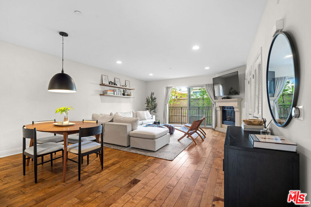 Modern Coastal Living in the Heart of Silicon Beach // Welcome to your new sanctuary in Playa del Rey where laid-back beach vibes meet everyday luxury // This expansive 2-bedroom, 2-bathroom residence is the perfect blend of style, comfort, and convenience. Step inside to discover a beautifully maintained home with rich hardwood floors and a light-filled open layout that's made for modern living. The well-appointed kitchen includes granite countertops, stainless steel appliances, generous cabinet space, and a breakfast bar that opens to the living and dining areas. Cozy up by the fireplace in the inviting living room or entertain effortlessly in the dedicated dining space. Slide open the doors to your private balcony for a dose of fresh coastal air, perfect for morning coffee or an evening wind-down. The spacious primary suite is a luxurious retreat with a spa-like bathroom, complete with double sinks, a soaking tub, and a separate glass shower. The second bedroom is smartly positioned on the opposite side of the unit, offering flexibility for guests or a home office. Additional highlights include in-unit laundry, central AC and heat, and two gated tandem parking spaces. This professionally managed building offers controlled access, a well-equipped fitness center, and a sparkling outdoor spa, ideal for post-workout relaxation. Located in a sought-after pocket of Playa del Rey, you're just minutes from the beach, bike path, and local hotspots like The Tripel, Playa Provisions, and charming neighborhood cafes. Don't miss your chance to live where the sun, surf, and city connect!