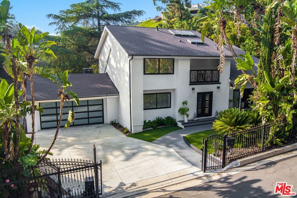Motivated Seller; bring all offers! Gated estate on nearly an acre lot in the highly coveted enclave of Mount Olympus. All 2,600+ SqFt of this 4 bedroom, 2.5 bathroom residence has been meticulously renovated with the finest finishes suitable for the most discerning buyer. The chef's kitchen is fully equipped with stainless steel appliances and a substantial center island, conveniently located just off of the living room for seamless entertainment. The dining room, currently used as a game room, opens up to the backyard for harmonious indoor-outdoor living and features a cozy double-sided fireplace. A generous guest suite with an en suite and a 145' projection TV completes the lower level. The primary suite is privately tucked away on the upper level and offers an abundance of closet space and a luxurious en suite with dual sinks, a steam shower, and a soaking tub. Also on this level are two additional bedrooms with their own terraces to enjoy the stunning canyon views. A true entertainer's paradise; the outdoor oasis includes a pool and spa, outdoor lounging areas, a sports court, and excess parking spaces. This residence has been consistently leased, also making it a lucrative investment opportunity.