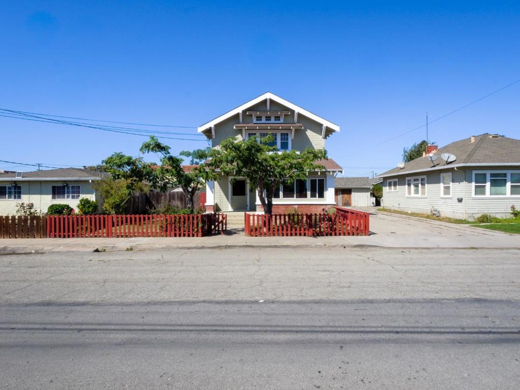 This property features two incredible homes on one APN! The front house, built in 1913, is a 3-bedroom, 2-bath, 1,752 sq ft craftsman that showcases many original architectural details. The rich woodwork, detailed molding, and timeless character are present throughout. Each bedroom features two closets, and the home includes a spacious laundry and mudroom, as well as a bonus storage room located off the front porch. The front and side yards provide privacy and outdoor space to enjoy and make your own. The second home was built in 2001 and offers 3 bedrooms, 2.5 baths, and 1,320 sq ft of living space above a 440 sq ft two-car garage. It includes a mudroom, laundry area, and a versatile bonus room adjacent to the garageperfect for a home office, gym, or studio. This property seamlessly blends historic charm with modern functionality, making it an ideal choice for multigenerational living, the owner-occupant seeking rental income, or investment.