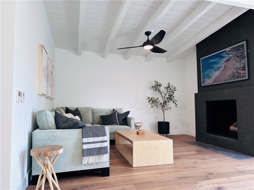 FURNISHED Modern Beach Retreat! Available August 20th, 6+ months. Beautifully Remodeled 3 bedroom, 2 bathrooms 1500 SF home 5-10 min walk to beach, restaurants, and shopping! An open floor plan and high end indulgences include stunning hardwood flooring, air conditioning, heated floor tiles in the bathrooms, steam shower and much more! End the beach day lounging and having a BBQ on your comfortable deck or pour a glass of wine and curl up next to the fire on the lower private patio.