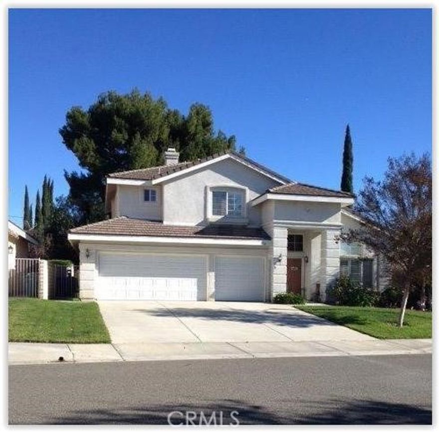 Beautifully Updated Two-Story Home on a Peaceful Cul-de-Sac

Built in 2001 and tucked away on a quiet cul-de-sac, this recently painted two-story home offers four bedrooms and three full bathrooms within an open, light-filled floor plan. Rich wood flooring and oversized windows create a warm and inviting living environment.

The kitchen features granite countertops and modern appliances and opens seamlessly to the family room with a cozy fireplace. The main level includes a bedroom with a full bathroom, a flexible room ideal for a home office or gym, and a convenient laundry room with direct access to the three-car garage.

A well-designed staircase leads to the second level, where two bedrooms share a spacious full bathroom. The generously sized primary suite offers a private retreat with a luxurious en-suite bath featuring dual sinks, abundant cabinet storage, a soaking tub by a window, and a walk-in closet.

Outdoor living is a highlight of the home, featuring a large enclosed patio with a waterfall fountain, durable low-maintenance cement flooring, and a spa—ideal as additional living space or a playroom. A separate back patio and expansive yard provide ample space for gardening, entertaining, and outdoor enjoyment.

This move-in-ready property combines comfort, functionality, and inviting indoor-outdoor living. And is expected to sell quickly.