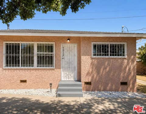 Photo of 1512 W 103rd Street, Los Angeles, CA 90047 (MLS # 26861981)