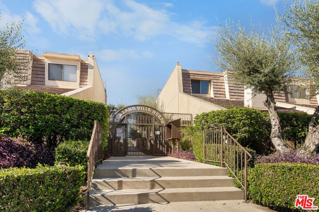 Welcome to this beautifully spacious 2-bedroom, 2.5-bath townhome, offering 1,659 sq ft of comfortable living space in the highly desirable gated community of Tarzana Villa North. This stunning home features an open floor plan, a private and oversized 2-car attached garage, and ground-floor living with no neighbors above or below for added privacy and tranquility. Its prime location boosts convenience and charm. The bright, inviting living room features a cozy fireplace and a sliding glass door that opens to a large, private patio, perfect for relaxing, barbecues, or entertaining guests. A separate laundry room, conveniently located just off the kitchen, provides ample storage space and easy access for everyday tasks. Upstairs, the beautiful and spacious primary suite offers a large walk-in closet with built-in shelves ideal for organizing your wardrobe. The suite's bathroom has double sinks, a generous vanity, and a walk-in shower, making it a comfortable and functional space. The oversized second bedroom has its own walk-in closet with built-in storage and a private balcony, ideal for morning coffee or unwinding in the evening. The second bathroom is located next to the bedroom. You will enjoy resort-style living with amenities such as a pool, spa, clubhouse, or rec room. Low HOA dues cover water, trash, and earthquake insurance. The property is located centrally near restaurants, shops, grocery stores, schools, and parks. This is one you won't want to miss! This is a remarkable townhome.