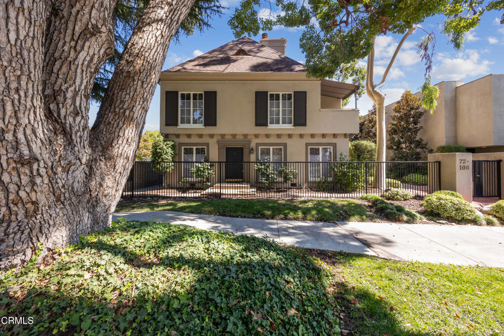 Elegant French Normandy Townhome in Prime Pasadena Location. Nestled on one of Pasadena's most prestigious and sought-after streets, this stunning two-story condominium is located within a gated French Normandy-style complex, surrounded by beautifully manicured grounds.Showcasing timeless elegance and sophistication, the home features 9' ceilings, rich hardwood floors, and an abundance of natural light streaming through charming French doors and windows. The spacious living room centers around a decorative fireplace, while the formal dining room flows seamlessly into a bright, well-appointed kitchen with a gas range, stainless steel refrigerator, and a full-size washer and dryer. The primary suite offers another decorative fireplace, generous closet space, and a beautifully remodeled en-suite bathroom with high-end, timeless finishes. The second bathroom has also been thoughtfully renovated to match in style and quality.