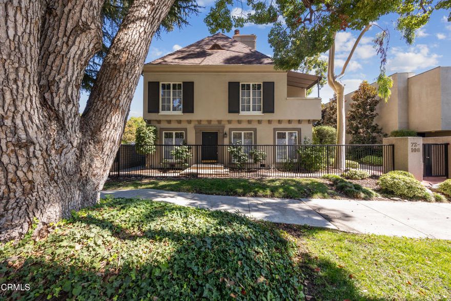 Elegant French Normandy Townhome in Prime Pasadena Location. Nestled on one of Pasadena's most prestigious and sought-after streets, this stunning two-story condominium is located within a gated French Normandy-style complex, surrounded by beautifully manicured grounds.Showcasing timeless elegance and sophistication, the home features 9' ceilings, rich hardwood floors, and an abundance of natural light streaming through charming French doors and windows. The spacious living room centers around a decorative fireplace, while the formal dining room flows seamlessly into a bright, well-appointed kitchen with a gas range, stainless steel refrigerator, and a full-size washer and dryer.  The primary suite offers another decorative fireplace, generous closet space, and a beautifully remodeled en-suite bathroom with high-end, timeless finishes. The second bathroom has also been thoughtfully renovated to match in style and quality.