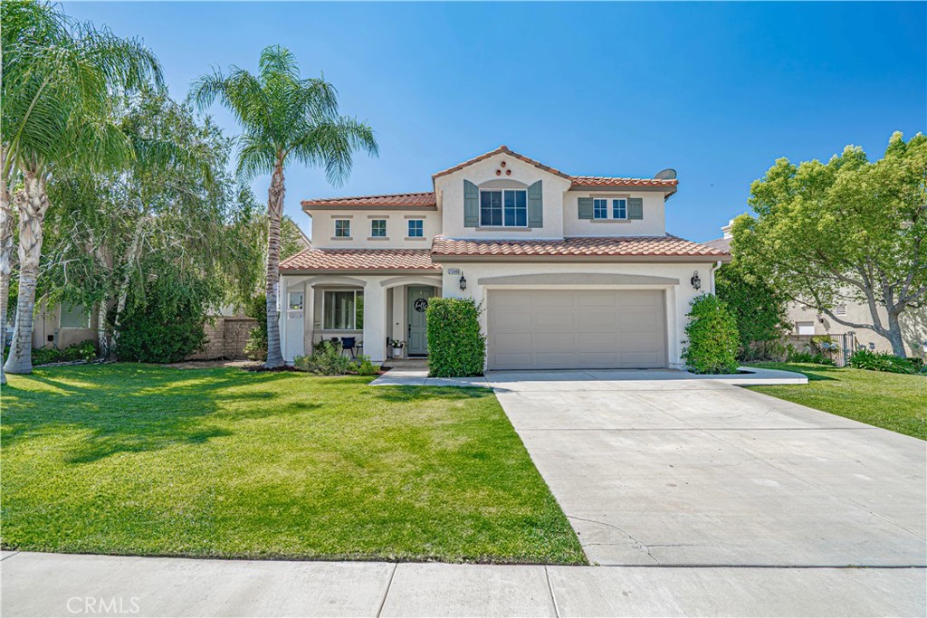 Welcome to Rustico Court in The Ranch at Tesoro Del Valle—one of Valencia’s most sought-after neighborhoods! Located on a quiet cul-de-sac with the second-largest lot on the street, this spacious home offers nearly 3,020 sq ft, 5 bedrooms, and 3 full bathrooms, including a full bedroom and bathroom on the main level—ideal for guests, multi-gen living, or a home office. Freshly painted inside and out—this home is move-in ready! The remodeled kitchen is a chef’s dream with quartz countertops, KitchenAid appliances, and 4 ovens (double oven, oven/range combo, and built-in Advantium microwave). Custom dark alder wood cabinets provide exceptional storage with soft-close doors and drawers. Additional highlights include ,Engineered hardwood flooring throughout both levels, Fully remodeled downstairs bath with added shower, Huge primary walk-in closet with brand-new carpet, Extra flooring included for optional primary bath upgrade. Pool-sized backyard ready to customize for your dream outdoor space, 33-panel SunPower solar lease at just $287/month, keeping electric bills low,Low Mello-Roos tax. The Tesoro HOA offers some of the best amenities in Santa Clarita for just $189/month, including:Private lake & clubhouse, Olympic-sized lap pool, huge kids’ pool, and 2 hot tub, Fitness center, outdoor kitchens, and picnic areas, Parks, playgrounds, basketball, tennis, and sand volleyball courts, Baseball & soccer fields, Horse, bike, and hiking trails, Walk or bike to top-rated schools (Tesoro Del Valle Elementary, Rio Norte Jr. High, and Valencia High) and enjoy easy access to shopping, dining, and the 5 freeway. Don’t miss this rare opportunity to own in one of Southern California’s premier communities—Rustico Court is calling you home!