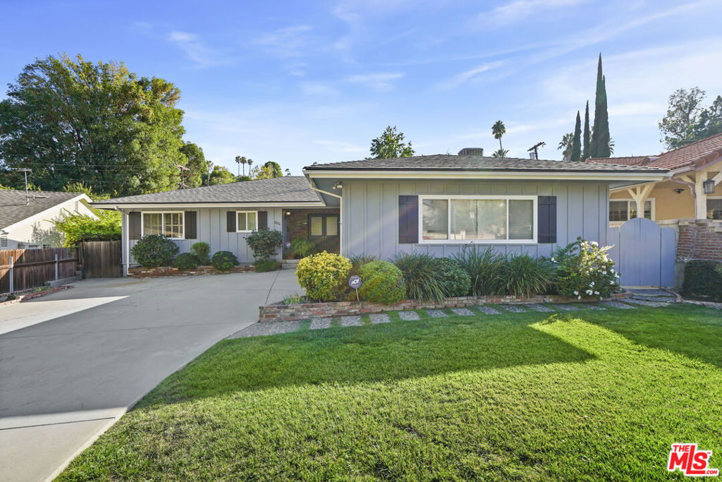Welcome to this south-of-the-boulevard diamond in the rough, tucked away in one of Woodland Hills most sought-after neighborhoods. This charming 3-bedroom, 2 1/2 bathroom home offers over 2,000 square feet of living space and endless potential. Move right in, or bring your vision to create the home of your dreams. Inside, you are greeted by a spacious family room that flows into the dining area and seamlessly connects to the kitchen, creating the perfect setting for gatherings and entertaining. The expansive primary suite features abundant closet space and an updated en-suite bathroom. Step outside to a private backyard oasis on a generous over 9,000 square foot lot where a lush lawn, flowering borders, and mature apple and lemon trees create a serene escape. Complete with a covered patio and a pergola seating nook, the outdoor space is perfect for gatherings, dining al fresco, or simply relaxing in the sunshine. Perfectly situated near award-winning schools, popular restaurants and shopping, this home combines tranquility with convenience. A rare opportunity to create your ideal Woodland Hills retreat. Come to one of our open houses this Saturday or Sunday 10/4-5 1pm - 4pm & see this fantastic home for yourself.