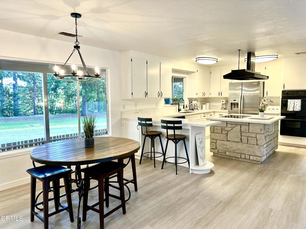 Tucked in the heart of the Sierra Foothills, this beautifully remodeled home offers the perfect mix of seclusion, comfort & natural beauty ideal for full-time living or weekend retreat. For locals, it's a rare chance to live closer to nature without losing convenience. For second-home seekers, a private escape that feels worlds away yet within reach of the Bay Area, Sacramento, skiing at Kirkwood & Bear Valley, plus award-winning wineries. All appliances included turnkey, move-in ready. Set on nearly 10 forested acres w/open field, this 3-bed, 2-bath home (solar + PG&E) sits above the S Fork of the Mokelumne River. BLM land borders the propertyride, hike, or bike straight to the river & beyond. Hundreds of acres of untaxed land to explore, hunt, fish, or ride. From the driveway, you'll hear birdsong, swaying pines & feel the calm of foothill living. Patios invite you to watch deer at dawn, turkeys at noon, hawks at sunset. A 2-bed, 2-bath vintage mobile/ADU brings income or use as guesthouse/MIL unit. Room to expand: RV hookups, more ADUs, shop, horses/livestock zoning supports it. Gold miners say a rich vein runs through the land. Properties like this don't come often act fast before it is gone!
