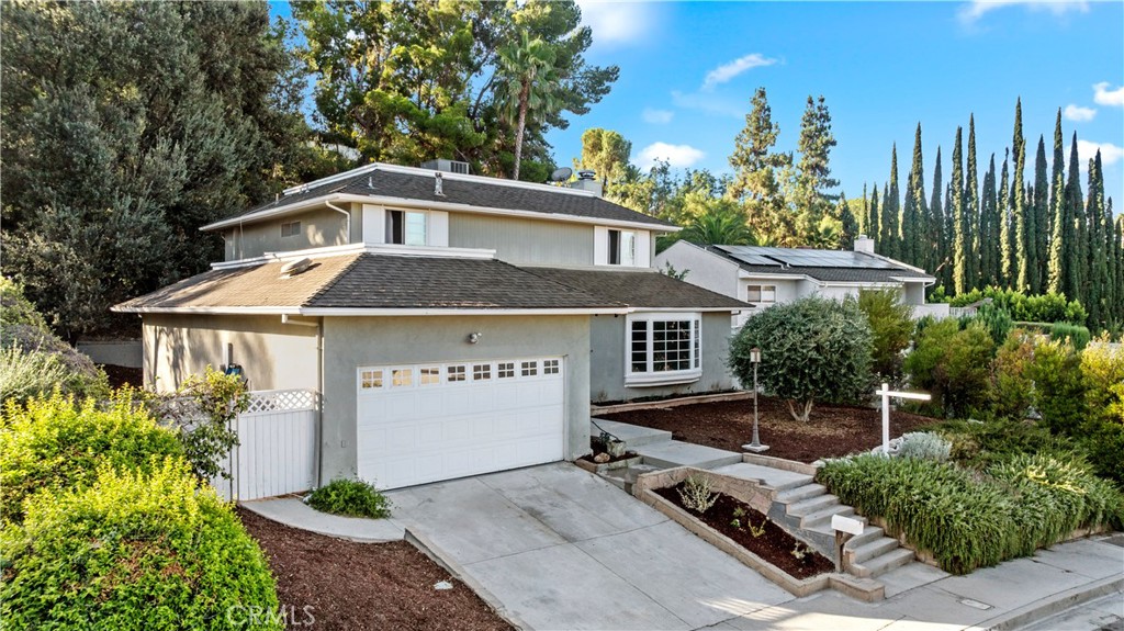 Welcome to this spacious and distinctive residence located in the prestigious Heritage Lakefront Estates of West Hills! Featuring 5 bedrooms and 4 bathrooms, this home offers nearly 2,949 sq ft of living space on an expansive 11,720 sq ft lot. Step through the double-door entry into a grand foyer with soaring ceilings and a sweeping curved staircase. The formal living room offers a subtle view of the scenic Rocky Mountain backdrop, while original wood details and large windows create an inviting, light-filled atmosphere. The generous layout provides room for entertaining, family gatherings, and everyday living. Outside, the private backyard offers endless possibilities with ample space to design your ideal retreat. A rare opportunity to own a home of this size and character in one of West Hills’ most desirable neighborhoods!