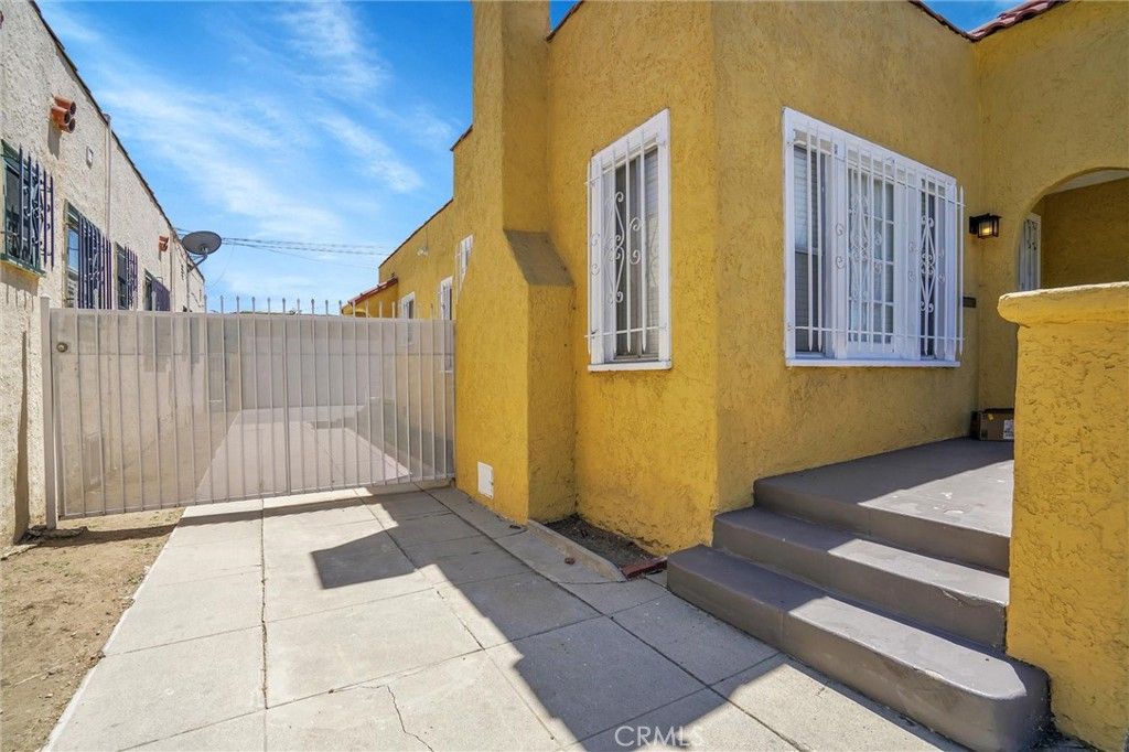 Photo of 1054 W 81st Place, Los Angeles, CA 90044 (MLS # SB25282336)