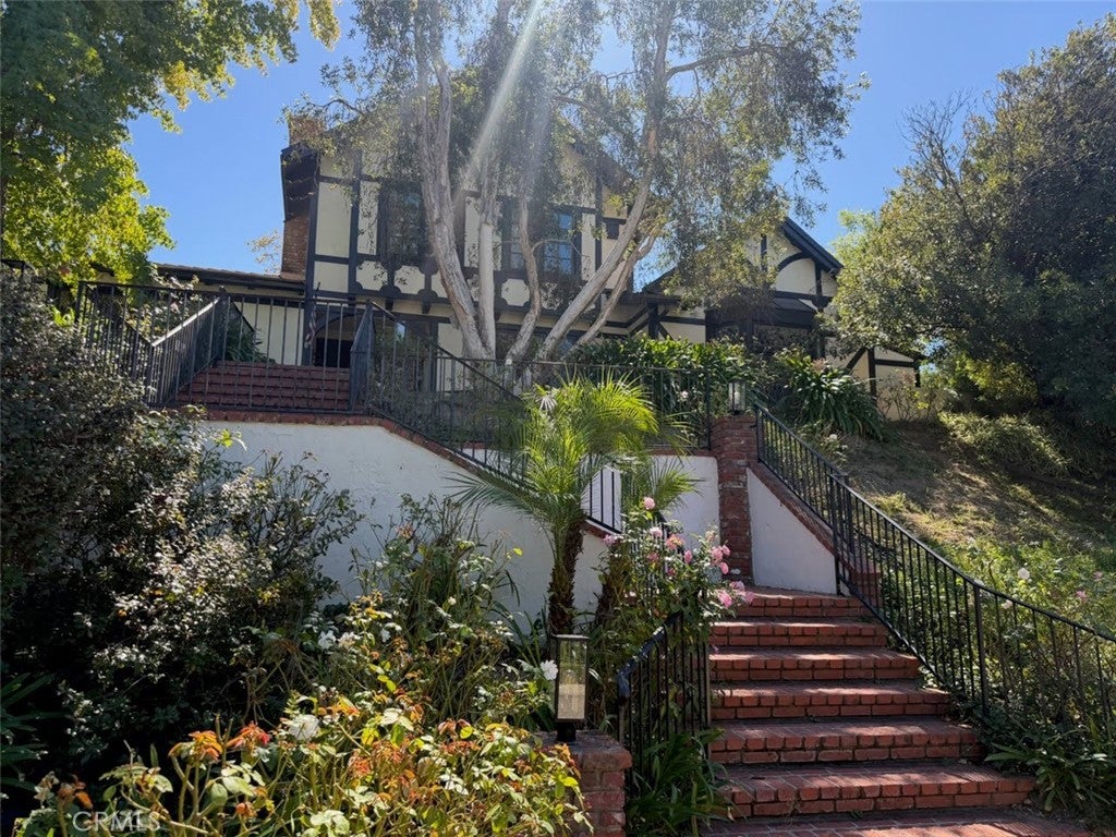 Photo of 21222 Mulholland Drive, Woodland Hills, CA 91364 (MLS # CV26229451)