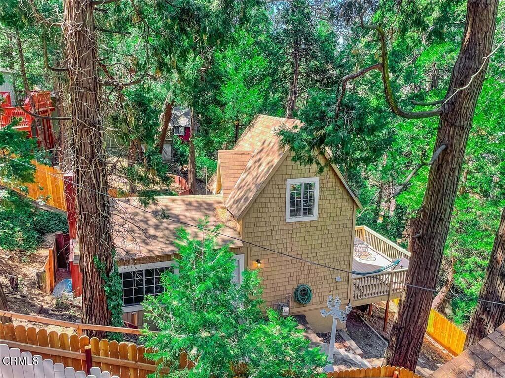 MOTIVATED SELLER! Cozy mountain living with all of the modern amenities! This renovated Crestline property is a cant-miss! Featuring all recently re-donedrywall, paint, roofing, kitchen cabinets and quartz counters, tiled shower with tub, upstairs flooring, light fixtures throughout, electrical, PEX plumbing, water heater and AC/heater; this home is truly a great find! Enjoy the convenience of public water and sewer, natural gas and home internet through Spectrum.The home will also include all furniture including couches and couch pull-out bed downstairs, tables, bed frame, and queen bed all bought from Ashley Furniture, all appliances including washer/dryer, refrigerator, stove and microwave. Relax on the spacious deck with beautiful mountain viewson the cozy patio furniture or entertain with the outdoor TV and propane powered BBQ on those warm summer nights. This property is also located within a mile of the famous Goodwin's grocery store, fishing, boating and summertime hot spot Lake Gregory and local restaurants and bars. This property checks all of the boxes whether it be a primary residence, investment property, Air BNB or your very own private mountain getaway! Don't miss this unbelievableopportunity!