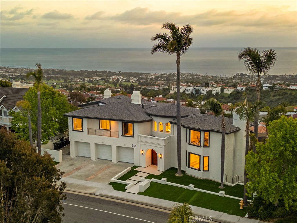 This stunning custom estate in San Clemente offers an unparalleled blend of luxury, size, and breathtaking views. With nearly 7,000 square feet of refined living space, this fully renovated 5-bedroom, 6-bathroom residence is designed to capture panoramic ocean, canyon, and mountain views from every room and its five unique balconies.
Property highlights include:
• Expansive interior layout of approximately 7,000 sq ft
• Five balconies, each offering unobstructed ocean and mountain vistas
• Rare single loaded street location for maximum privacy and tranquility
• Wine cellar and private sauna for ultimate relaxation
• Two exceptionally large primary suites located on the first and third floors
• Huge family room, perfect for gatherings and entertaining
• Dedicated office space featuring rare dual views of both the canyon and coastline
• Fully permitted renovation with modern, high-end finishes
• Three-car garage for ample parking
This is more than a home—it’s a lifestyle of luxury and serenity, where every corner frames a cinematic backdrop of San Clemente’s coastal beauty. Don’t miss this rare opportunity to own a home that truly has it all.