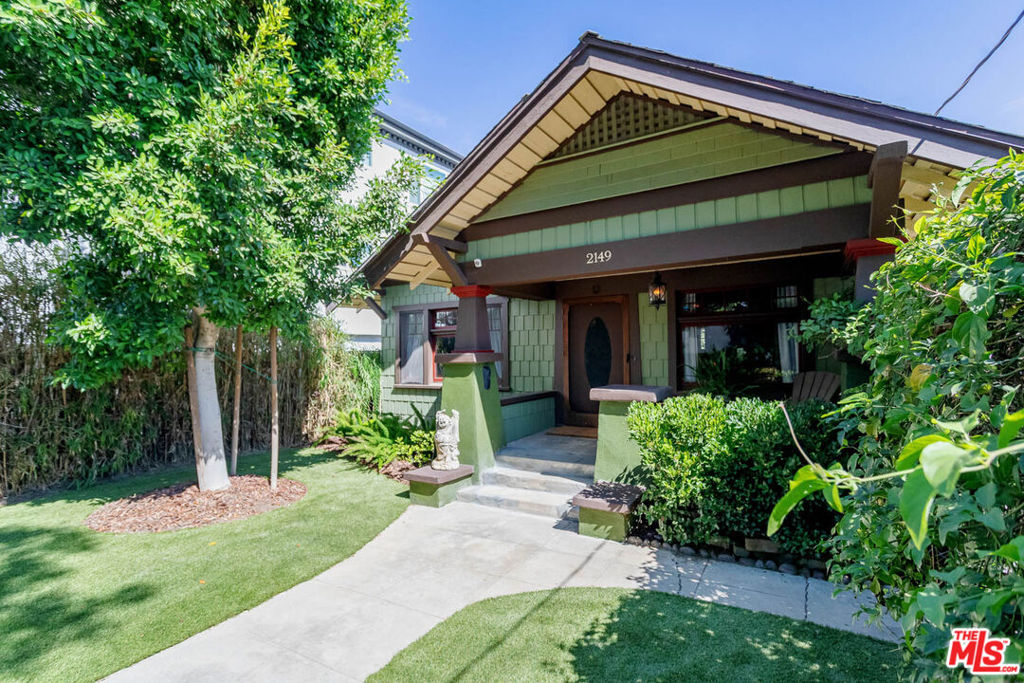 Step through time into this grand and keenly preserved 1912 Craftsman bungalow, set behind lush green arches of Ivy and Jasmine. Private artists retreat with free standing art studio, enclosed patio, wood shop and tiki themed bonus room offers a truly unique rental opportunity for those who desire a blend of preservation and modern living. Terrific location set up on a buff delivers views of Silverlake and Echo Park and the hills beyond. Near to everything the area has to offer, including Echo Park Lake. Enter through front yard onto charming covered front porch, through oversized original mahogany door into formal living room. There you will find a quiet setting with stately fireplace, original wood beams and classic built ins, paneling and hardwood floors throughout. To the left is a parlor with secret built-in wood desk. Dining room is the center of the home, made for formal entertaining set off by the leaded glass cabinetry and wood bench seating. Airy rear bedroom has lovely windows and peaceful views. The main bedroom has ensuite jack and jill bath with claw foot tub and custom designed tile wall. Kitchen has views with modern stainless steel appliances, stone counter-tops, plentiful kitchen cabinetry and breakfast area. From the kitchen enjoy a rear enclosed screened patio with calming fountain perched over large gated rear yard. Travel down the stairs to the 1st floor that has a unique tiki styled bonus room which could be a studio, office, or guest room (nearly 500 sq ft). Also includes separate laundry area with side by side washer and dryer as well as a workshop. Lush tropical landscaping surrounds the backyard, with several areas to entertain. Find the substantial studio/flex space at the rear of the property with tons of light and floor to ceiling glass doors that look onto lush surroundings. A true sanctuary in the city. Gated parking. Cats ok and dogs under 35lbs welcome. Schedule your private tour today.