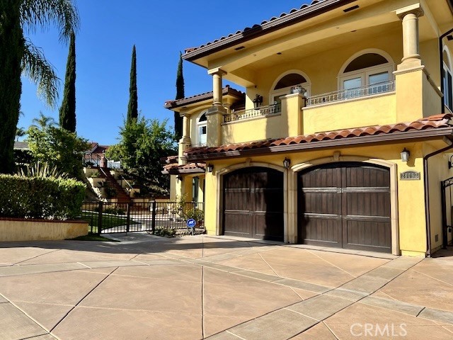 Stunning Mediterranean House located on a large private corner lot featuring beautiful landscape, heated pool & spa, BBQ and entertainment area. Great view of the hills, city lights and Golf Course. Many custom upgrades and open floor plan boasting spacious vaulted ceiling entry with nice spiral stairway, inviting living room, formal dining and separate Family room. Nice kitchen includes custom cabinets, granite counter tops and upgraded appliances for your enjoyment. Second floor embraces an Elegant Master Suite with Fireplace, private covered balcony, an exquisite Marble Master Bath including separate Shower and jetted Soak-in Tub area for relaxation. Two additional ensuite beautiful bedrooms and a sitting/bonus area for watching TV, or work space.
Comfortable Guest Suite with private Bath and separate entry plus, office/second bedroom conveniently located on the first floor. Remodeled with updated plumbing and electrical, Tankless Waterheater, security system with multiple surveillance cameras, central air, sound system and EV Charger in the garage.
Great location with easy access to Freeways, close to Best Schools, Shopping, Entertainment, Beach and many beautiful OC Resorts. Walking distance to Golf course and golf club with many amenities. Rent includes Membership to Lake Mission Viejo for Beach, Water Sports, Boating, Concerts and Entertainment activities.
Furniture Negotiable.