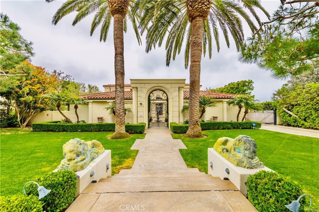 This exquisite, fully furnished estate is situated in the exclusive gated community of Pelican Hill on Newport Coast, offering utmost privacy and ample space from nearby homes. The residence has recently undergone a renovation, enhancing its grandeur with a full security system, a residential elevator, and pet-friendly accommodations that combine luxury with practicality and security. The property serves as a tranquil haven. Entry through private gates and a lovely courtyard leads to an impressive two-story foyer adorned with a sweeping staircase. This sprawling 8,000+ square-foot home features five lavish bedroom suites and 5.5 bathrooms.
On the main level, there is a recently updated kitchen complete with a walk-in pantry, an ocean-view media lounge, an indoor gym, a laundry room, and a three-car garage. An elegant formal dining room, a cozy living room with a fireplace, and two guest bedroom suites.
The home boasts a clean and bright interior with white decor and elegant, high-quality furniture. It has two additional bedrooms suites, a huge home office on the first floor, and convenient laundry facilities on both floors. The house features a smart system that lets you control the lighting, sound, and security systems from your smartphone. It's equipped with three water heaters and smart toilets. All five bathrooms have towel racks that can be heated electrically for added comfort. Additionally, the home includes a hot water circulation pump and electric curtains, enhancing both convenience and the overall living experience.
The upper level houses a private master suite, two additional bedroom suites, and a landing area that looks out over the grand foyer. Outside, the estate boasts expertly designed hardscaping, an outdoor dining space, a BBQ area, and verdant landscaping. The property offers stunning views of the Pacific Ocean, year-round sunsets, and Catalina Island, creating a picturesque setting. This estate is an ideal sanctuary for those desiring a perfect mix of luxury, comfort, and security.