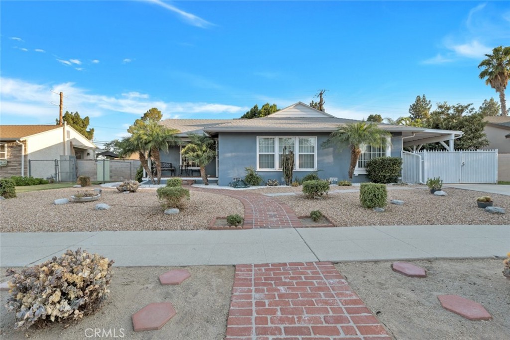 Located in the desirable community of Granada Hills, this spacious 3-bedroom, 1.5-bathroom home offers approximately 1,200 square feet of comfortable living space. Featuring a bright and open layout, the home includes a large living area with a charming brick fireplace and access to a covered patio—ideal for indoor-outdoor living. The updated kitchen showcases quartz countertops, modern cabinetry, and stainless steel appliances, making it both functional and stylish. The bedrooms are generously sized with ceiling fans and ample closet space, while the bathrooms feature clean, classic finishes. Additional highlights include updated flooring throughout, abundant natural light, and central air and heat. Set on a well-maintained lot, this home is conveniently located near parks, shopping, and freeway access. A wonderful opportunity to own in one of the Valley’s most established neighborhoods.