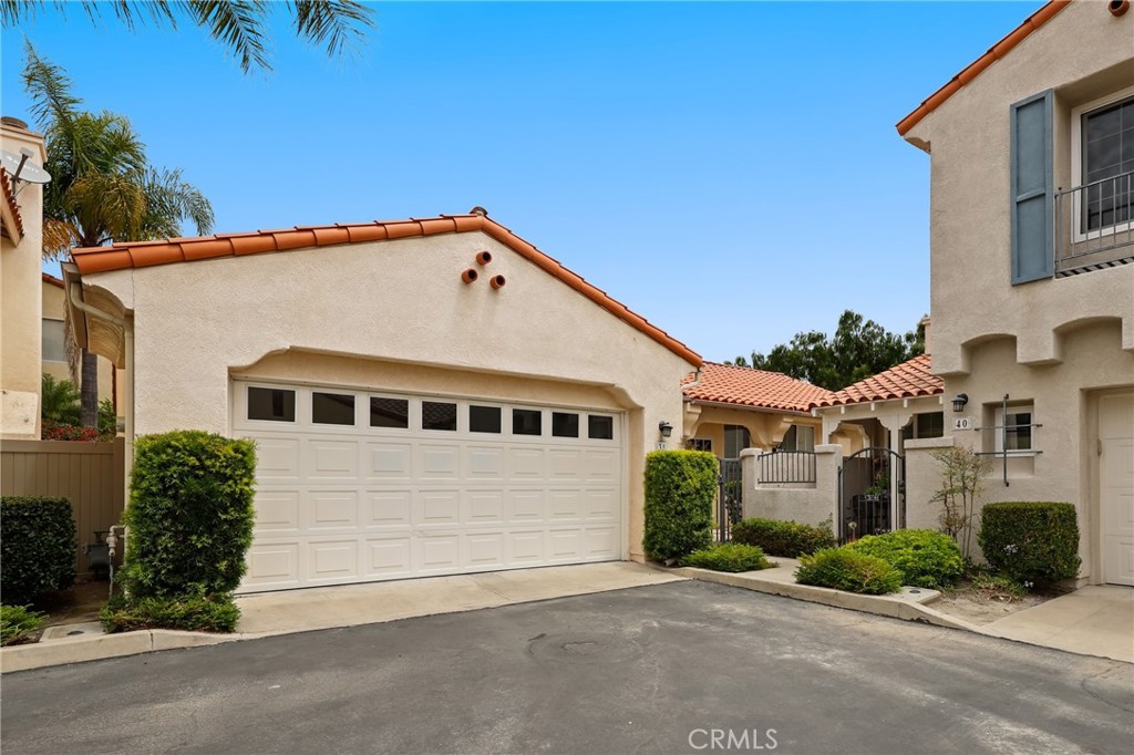 Perfectly situated in the sought-after Colony community of Aliso Viejo, this single-level, open floor plan residence offers 3 bedrooms and 2 bathrooms with stunning city lights views. Recently updated with new paint, kitchen appliances, and recently upgraded flooring, the home boasts dramatic high ceilings, a cozy fireplace, and abundant natural light throughout. Enjoy serene canyon views from large windows and a spacious patio. The property features direct access to an oversized 2-car garage, a separate laundry room, and ample storage space with plenty of cabinets and generous countertops in the large, bright kitchen. Retreat to the elegant master bedroom suite for privacy and comfort. Located in a quiet, safe neighborhood, residents have easy access to hiking and biking paths in the canyon, as well as proximity to the 73 Toll Road, I-5, and 405 Freeway. Discover nearby wilderness areas, parks, shopping centers, restaurants, a movie theater, and the stunning beaches of Laguna Beach. With bike and walking trails just moments away, this home offers an ideal blend of convenience and tranquility. Don't miss out on this exceptional opportunity!