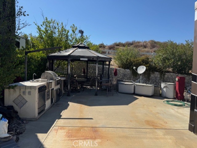 Come and enjoy this lot with privacy wall and hedges, built-In BBQ, Dishwasher, Ice maker and Fridge with a large Gazebo for shade and entertaining. This lot backs to the BLM Land and even has golf cart parking and lots of area to store all your extras. Just down the street from the fishing pond, pool, clubhouse, market and restaurant. RV also for Sale, Inquire... Premier RV Resort located in SoCal minutes from Temecula Wine Country and close to San Diego, Oceanside and Palm Springs! Rancho California RV Resort offers a 14 hole PAR 3 executive golf course that is free for owners, (5) pools & jacuzzi areas, tennis courts, pickleball courts, laundry rooms, dog park, horseshoe lawn, exercise room, (2) clubhouses, hiking trails, grocery market and restaurant all inside gated community that is guarded 24/7. Financing Available....