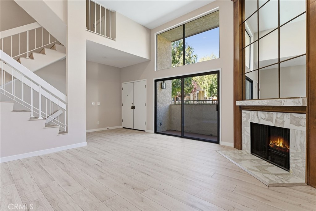 BEAUTIFULLY UPDATED 3-BEDROOM, 3-BATH TOWNHOME IN PRIME CALABASAS.  Move right into this turnkey, freshly painted townhome located in Las Virgenes Village, one of Calabasas' most sought-after communities and top-rated school districts. This spacious 3-bedroom, 3-bath home has been thoughtfully updated throughout and is ready for immediate occupancy.  Enjoy stylish upgrades including brand-new luxury flooring with updated baseboards, recessed lighting, remote-controlled ceiling fans, and a fully modernized kitchen with new stainless steel appliances. All three bathrooms have been tastefully remodeled, featuring new vanities, tile, fixtures, a new bathtub, shower, and toilets.  The open-concept living area boasts soaring vaulted ceilings and a cozy fireplace, creating a warm and inviting atmosphere. The primary suite offers a walk-in closet and a private balcony with views of the community pool and the Santa Monica Mountains.  Additional highlights include an attached two-car garage with direct access and a brand-new washer and dryer.  Ideally located just minutes from The Commons for premier shopping and dining, scenic hiking trails, quick access to the 101 Freeway and a short drive through the canyon to Malibu’s iconic beaches.  HOA dues include cable TV, internet, earthquake insurance, water, sewer, and pest control—providing exceptional value and peace of mind for a low-maintenance lifestyle.  Don’t miss this rare opportunity to own a beautifully updated home in the heart of Calabasas!