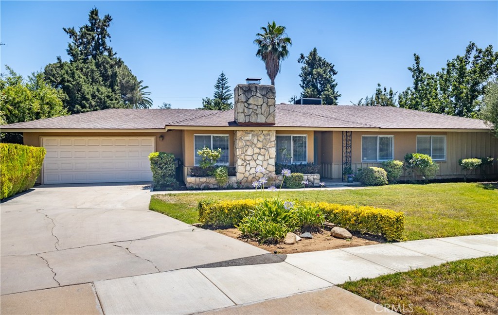 VOILA! Immaculate Single Story, Ranch Style JUST LISTED off Sunset Drive in the Redlands Country Club neighborhood and in Mariposa Elementary School. Good news here! THIS HOME IS NOT IN A FIRE ZONE and is sure to wow you with its new kitchen, All new flooring, new Interior paint, new window coverings, new bath vanities and the Central heat, Air ducting and insulation is only 2 years old! Oh, yes, the floor plan is also special. Enter into the formal foyer with the cool original terrazzo floor and into the very large living room with centered fireplace and generous hearth. Formal dining room also has a view of the fireplace giving the opportunity to dine in style. Ooh-la-la! The kitchen has been fully remodeled and includes a breakfast nook and direct access to the attached garage - making it very easy to enter home after a long day. Yes, you can see the family room from the kitchen and there is a sliding glass doors out to the covered patio. The back yard is VERY PRIVATE and a great spot to enjoy back yard entertaining and dining. This home has a very unique feature wherein 2 bedrooms share a folding wall/door. Hence you can open up the two bedrooms to be one bedroom, or make it one bedroom and a playroom, OR keep it separate as 2 bedrooms. Both rooms have closets. The Primary bedroom suite is spacious and offers 2 closets plus a door out to the rear patio. This home is in Mariposa School district and also offers easy freeway access off Ford Street (about 3-6 minutes).