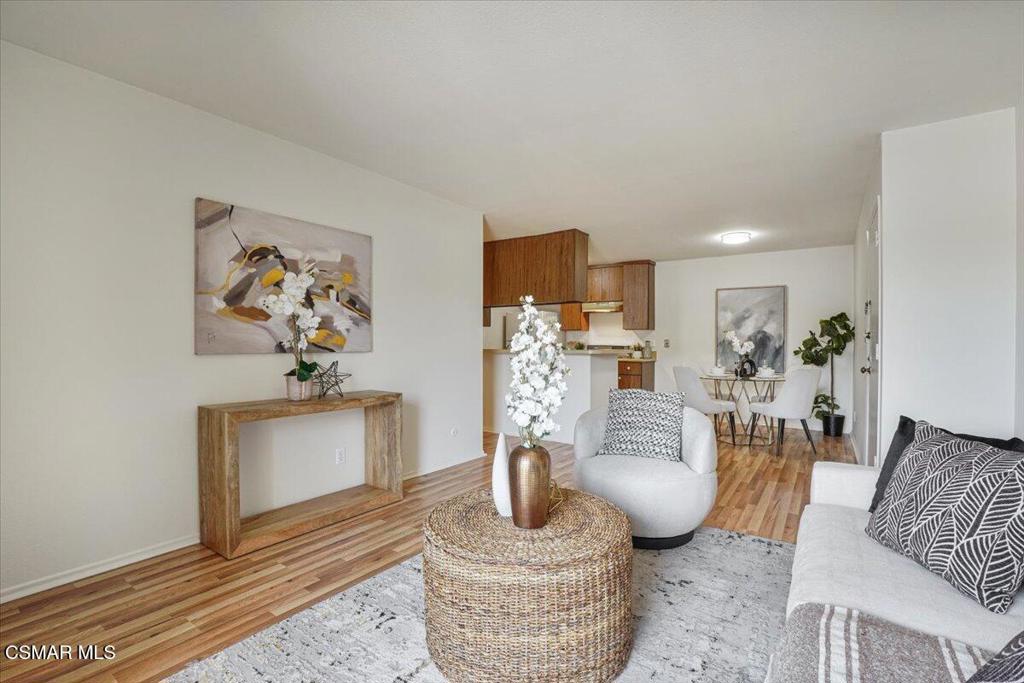 Welcome to this beautifully maintained condo, in the desirable Glendale Terrace community. Step inside to find warm, wood-look vinyl flooring that adds a modern touch and inviting ambiance throughout the home. The spacious living area opens to a private covered balcony through sliding glass doors, creating a seamless indoor-outdoor flow--perfect for morning coffee or evening relaxation. Freshly painted, the interior is ready for you to move in and make it your own. Enjoy resort-style amenities including a sparkling pool, rejuvenating spa, BBQ area, and a welcoming community room ideal for gathering with friends or unwinding with a book. Convenience is key with an assigned parking space and a secure storage cabinet located in the subterranean garage, complete with elevator access. Additional thoughtful features include a resident garbage chute and controlled access for added peace of mind. Situated in a prime Glendale location, you're just moments from top dining, shopping, and entertainment options, including the Americana at Brand. With easy freeway and public transit access, commuting is a breeze.