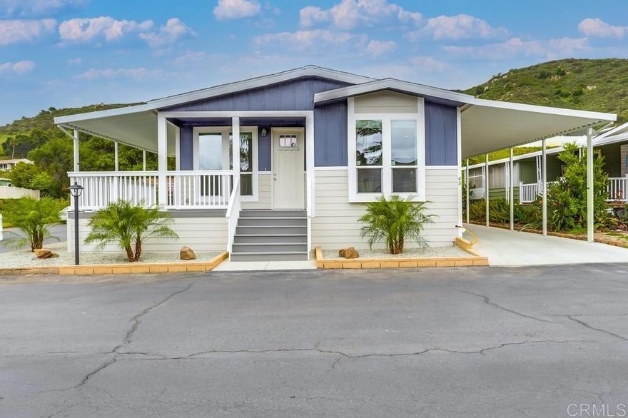 Amazing price for this BRAND NEW 3Br, 2 Bath home with everything you’ve been looking for and you OWN THE LAND – no space rent!  Free Golf & Tennis at Rancho Monserate Country Club.  Modern & bright, complete with 9-foot flat ceilings, dual pane windows, luxury vinyl plank flooring, many upgrades including stainless steel appliances, solid surface counter tops, recessed lighting, tile backsplashes, built in microwave, glass vent hood, farmer’s sink, deep pots & pans drawers, coffered ceiling with pendant lighting over a large island, & walk in pantry.  All bedrooms are spacious & come pre-wired for ceiling fans.  The primary bedroom also features a coffered ceiling & recessed lighting.  Out the front door is a covered custom wraparound composite deck with space to relax & appreciate the incredible breezes that come up through the valley from the ocean.  Corner lot with lovely curb appeal, close to guest parking, & a short walk to the beautiful Clubhouse.  Conventional, FHA & VA financing available.  2 pets allowed with approval.  $354 monthly HOA fee includes 96 acres of amenities including Tennis, Pickleball, Bocci Ball, Billiards, Table Tennis, Banquet Facilities, Card Room, Library, Pool & Spa heated year-round, Dog Park, Community Garden, Free RV Parking, Walking Trails, Places to Bike, Historic Mission Chapel, Pond, Putting Green & FREE Golf on the amazingly lush Golf Course!  Come visit your new dream home today!