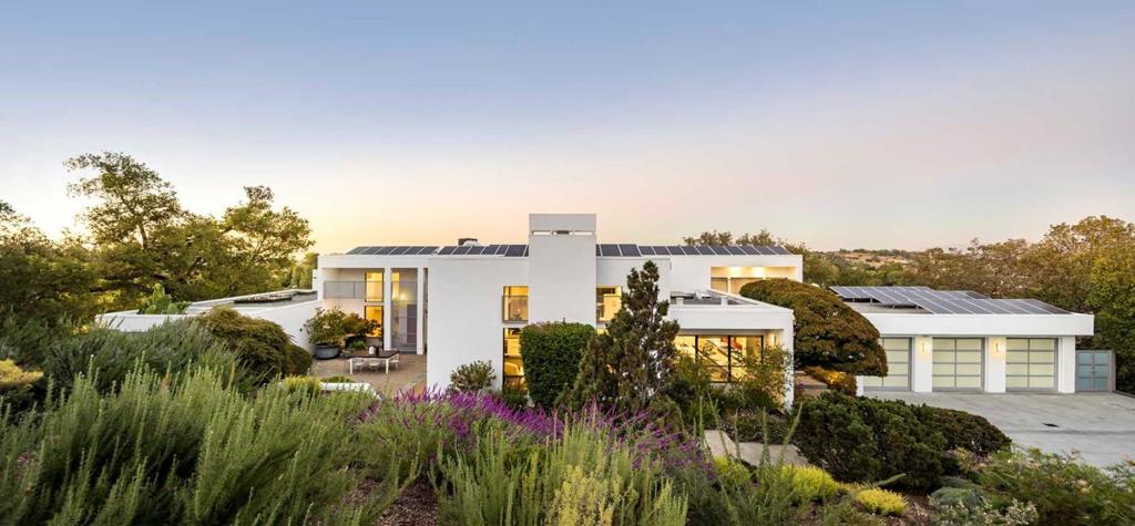 Contemporary design, top-of-the-line luxury, and the best of modern style and sophistication this 5-bedroom, 5.5-bathrom home of over 4,900 square feet exemplifies all of these qualities and more, nestled on 1.22 private acres with incredible views. From the moment you step inside, you will experience the grandeur this home presents, as towering windows stretch to the top of soaring ceilings and fill the space with natural light. Expansive gathering spaces include the living room with fireplace, the family room with a wine bar, and the ultramodern kitchen, winner of multiple design awards. The homes remarkable bedrooms include the master suite with a spa-like en suite bathroom, plus two guest suites, and an in-law unit with living space and kitchen. The entertainment options flow outside to the peaceful pool and spa area, shaded by towering trees that dot the surrounding landscape. Moments to the Palo Alto Hills Golf & Country Club, easy access to 280, served by Palo Alto schools.