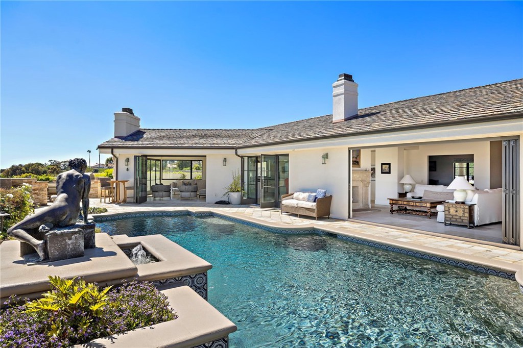 Perched on a private cul-de-sac, this exceptional ocean view home offers breathtaking panoramas of the Pacific from nearly every vantage point. Enjoy seamless indoor-outdoor living with a spectacular pool and spa, built-in BBQ, and expansive entertaining areas overlooking the coastline with views stretching to Catalina and the San Clemente Islands.
Recently renovated, this residence showcases elegant and tasteful finishes throughout, including French limestone floors, granite countertops, and luxurious marble details. Enjoy an oversized great room and living room flanked by retractable steel doors. The gourmet kitchen was thoughtfully designed with entertaining in mind and designed for both beauty and function. A walk in pantry and separate laundry room are also available for added convenience.
Step inside to a thoughtfully designed open floor plan, featuring three spacious bedrooms, three and a half baths, plus a dedicated home office that can easily be converted to the fourth bedroom. The primary suite boasts a king-sized bed, an en suite spa-like bathroom complete with steam shower and soaking tub. Two additional bedrooms offer twin beds, a queen bed and their own bathrooms so that each guest can enjoy comfort and privacy. An additional pool bathroom is available while enjoying the spectacular outdoor amenities.
This special beach home is ideally located just minutes from world-renowned resorts, pristine beaches, and Dana Point Harbor. The sandy shores of Laguna Beach are just a few miles north and the year round beach trolly makes a visit to town a breeze. Conveniently located just 15 miles south of John Wayne Airport.