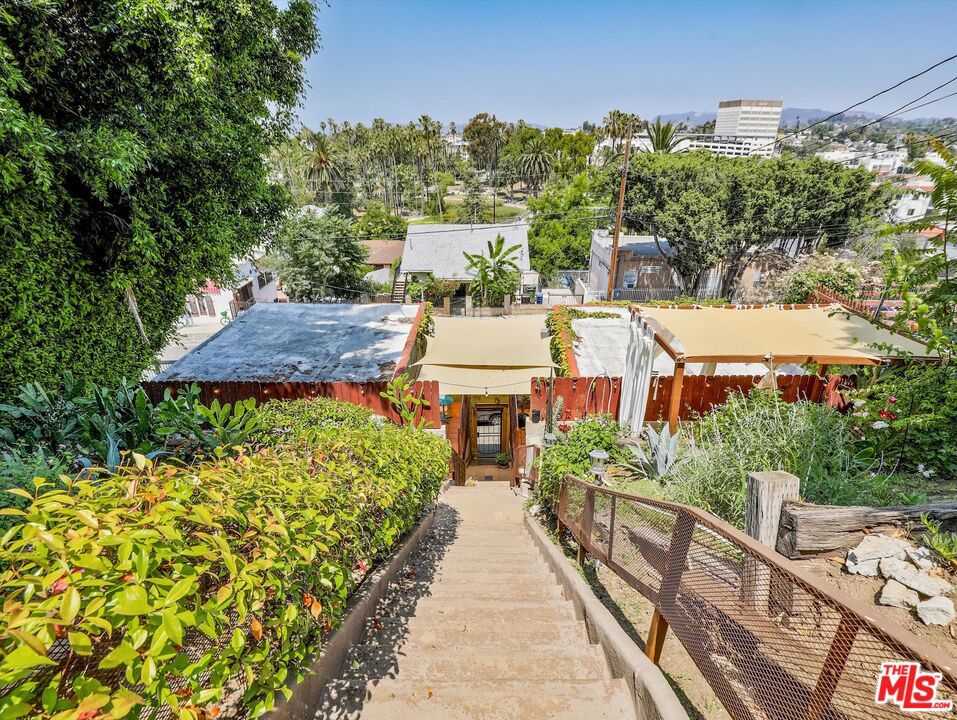 Rare Echo Park Lakefront 5-Unit Income Property with Stunning ViewsAn exceptional opportunity to own a trophy 5-unit income property in one of Echo Park's most coveted locations Echo Park Lake. Set on an elevated lot, this rare gem offers stunning views of the city skyline, combining timeless character with strong income potential.The well-maintained property features five unique units: two charming detached studio bungalows, a spacious 2-bedroom/1-bath unit, and two additional studio bungalow units in a separate building. Each residence has been thoughtfully updated to retain its original warmth and architectural integrity, offering inviting interiors and a peaceful atmosphere.Tenants enjoy the unbeatable experience ofliving above the lake, with Echo Park's walking paths, paddle boats, and gardens just steps from their front doors. The vibrant energy of local shops, cafes, and nightlife is mere minutes away, yet the property maintains a tranquil, park-side feel. Additional features include a detached garage offering off-street parking and storage potential. Whether you're an investor looking for stable income and long-term appreciation, or an owner-user seeking a legacy asset in anirreplaceable location, this is a truly rare offering in the heart of Echo Park.