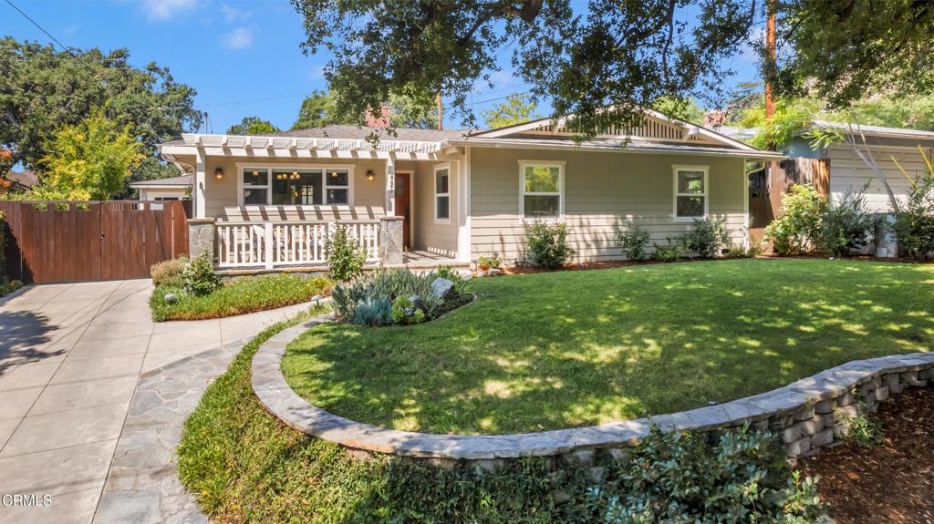 On a peaceful, tree-lined street in the sought-after City of Sierra Madre, this light-filled Craftsman-inspired bungalow blends timeless charm with thoughtful, modern upgrades.The expansive open floor plan flows seamlessly from the inviting living room with wood floors, French doors, and a fireplace to a cozy family room lined with custom built-ins. At the heart of the home, the remodeled kitchen stuns with new countertops, a butcher block center island, soft-close custom cabinetry, an undermount workbench sink, a pot filler, and striking architectural lighting. Just beyond, a peaceful den overlooks the pool, an ideal space for reading, relaxing, or working from home with a view.With four generous bedrooms, including a serene primary suite with a walk-in closet and a luxurious en suite bath featuring a soaking tub, marble tile, steam shower, and heated floors, this home offers both comfort and elegance.Recent major upgrades include: refinished hardwood floors and improved interior layout, new crown molding, base trim, pocket doors, high-end solid wood doors, upgraded hardware, recessed LED lighting and upgraded fixtures, fully remodeled bathroom and updated kitchen finishes, and custom-built closets for improved storage and organization.Additional system improvements that elevate peace of mind and functionality include an earthquake brace and bolt retrofit, copper plumbing and new main shut-off valve with exterior flush-out, tankless water heater and Halo whole-house water filtration system, eco-friendly, water-saving sprinkler system, wireless garage keypad entry, and a Phantom retractable screen door.Step outside to enjoy a lush, private oasis. The freshly stained deck has been completely rebuilt according to the original design and is perfect for outdoor entertaining. The pool and spa area offer a private relaxing retreat, surrounded by mature privacy trees, a partially replaced fence, a private, relaxing retreat with a mountain view, and beautifully maintained oak trees. A collection of ten fruit trees including apple, pomegranate, peach, lemon, and orange grace the yard, with additional potted citrus by the pool: Satsuma mandarin, lime, orange, and lemon.Just blocks from Bailey Canyon, Mt. Wilson Trail, and Sierra Madre's charming downtown shops, restaurants, and theatre, this home captures the essence of relaxed California living with elevated style and substance.