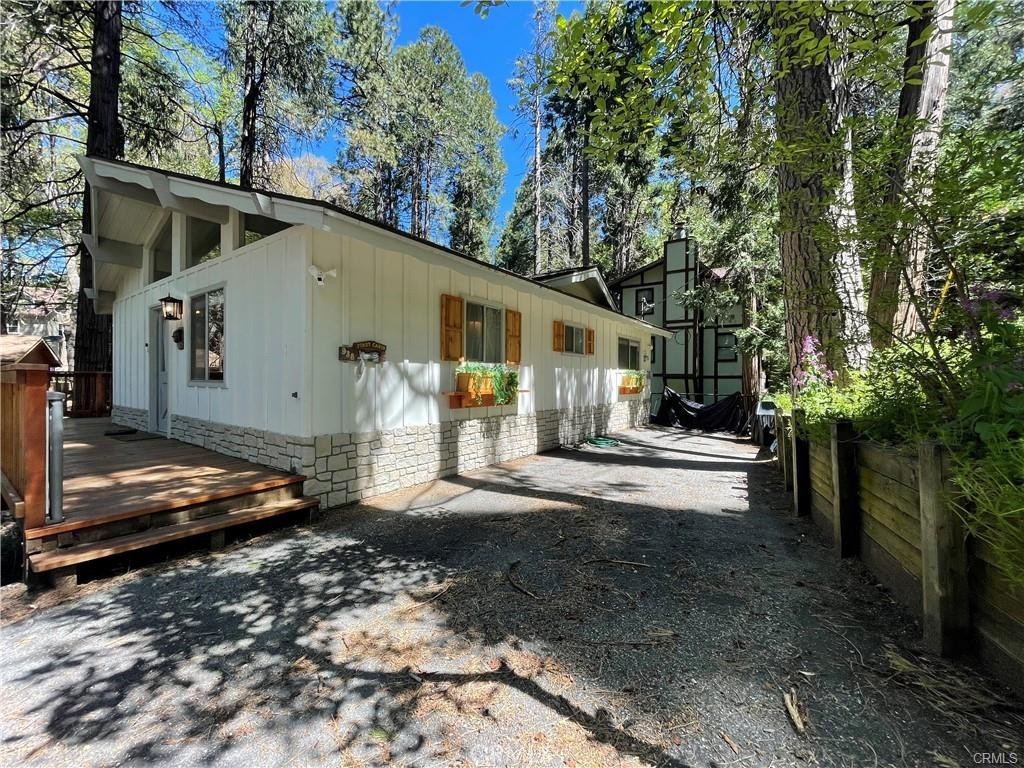 Nestled in the serene beauty of Crestline, CA, 938 Balfrin Dr presents a stunning rental opportunity for those seeking modern comfort and natural charm. This recently remodeled home boasts a sophisticated interior, featuring white quartz countertops, a farmhouse sink, and stainless steel appliances in the kitchen, catering to both style and functionality. The seamless flow of new hardwood flooring throughout creates an inviting ambiance, complemented by tasteful furnishings that exude contemporary elegance, ensuring a harmonious living space. Mini split cooling system to cool down the entire house.
Step outside onto one of the two patio decks to soak in the tranquil atmosphere, with the soothing sounds of a nearby water creek enhancing the sense of serenity. Whether you're unwinding in the comfort of your beautifully appointed home or exploring the outdoor wonders of Crestline, this residence offers a perfect blend of modern luxury and natural beauty, promising a lifestyle of relaxation and rejuvenation.