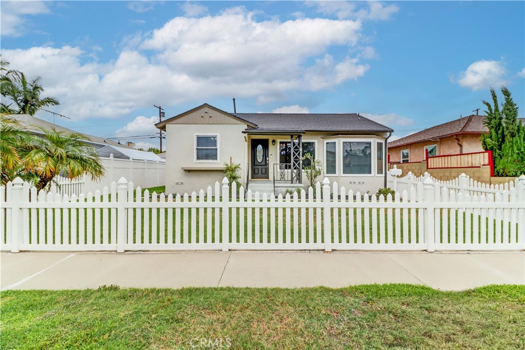 Welcome to this beautifully remodeled home brimming with curb appeal and classic charm, framed by a white picket fence and set in a picturesque, centrally located neighborhood. Step inside and enjoy the perfect blend of timeless character and modern upgrades. The home sits on a raised foundation and features stylish luxury vinyl plank flooring, new roof and AC, and fresh finishes throughout. A spacious, enclosed patio provides year-round versatility—ideal as a bonus room, sunroom, or indoor-outdoor entertaining space. The detached two-car garage and long, gated driveway offer ample parking, including room for extra vehicles, toys, or even a small RV. The private backyard is a peaceful retreat, perfect for relaxing or entertaining under the stars. With modern updates, a charming exterior, and a location that puts you near everything, this home checks all the boxes. Don’t miss the opportunity to live in one of the area's most beautiful neighborhoods!