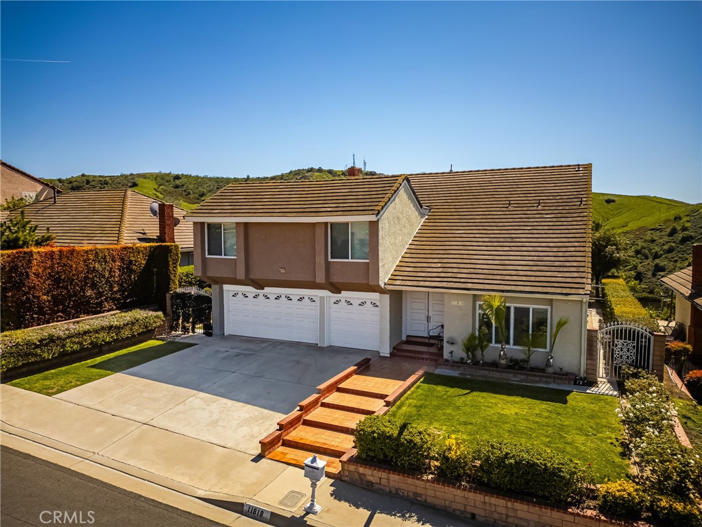 THIS HOUSE IS NOW RANGED PRICE PLEASE CHECK MLS. Spacious, stylish, and close to the city—welcome home to Spy Glass! One of the standout features of this impressive residence is the nearly 500-square-foot bonus room, offering endless possibilities as a media room, home gym, creative studio, playroom, or all of the above. Located just 15 miles from Downtown Los Angeles in the desirable Spy Glass community, this two-story home offers over 3,000 square feet of flexible living space designed for the way you live today. Step through dramatic double doors into two generous living areas and both formal and casual dining spaces, perfect for entertaining, relaxing, or gathering with family and friends. High ceilings and abundant natural light create an inviting, airy feel throughout. The primary suite is a luxurious retreat featuring vaulted ceilings, a spa-inspired bathroom with soaking tub, dual vanities, and a walk-in closet that could rival any boutique. Three additional oversized bedrooms provide plenty of space for family, guests, or a dedicated home office. Remodeled bathrooms showcase stylish contemporary finishes, while well-maintained wall-to-wall wood flooring brings warmth and timeless appeal. Enjoy new appliances, ceiling fans throughout, a spacious laundry room, and a three-car garage with ample storage for all your needs. Step outside to a private backyard oasis perfect for outdoor dining, entertaining, or simply unwinding in peace. Homes like this rarely hit the market, offering room to grow, space to thrive, and a lifestyle upgrade you deserve. Don’t miss your chance to make this stunning property your forever home—schedule your private tour today and discover why Spy Glass living is worth the move!