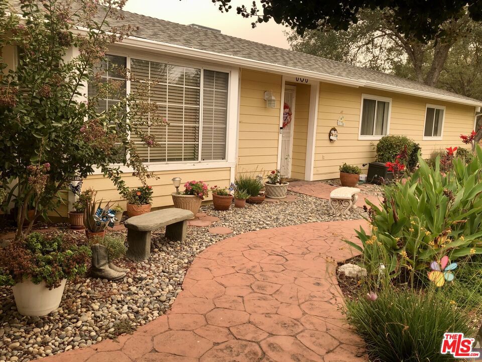 This ranch style home offers a close to nature lifestyle on an elegant hilltop with visions of beautiful sunsets. Almost 3 acres, supplying opportunity for large and small animals to reside, horses, cattle, sheep, etc. Ranch-farm life in a very quiet end of the cul de sac location. The backyard offers uninhabited mountain/tree views for miles! Country kitchen with granite countertops and tile floors throughout kitchen, bathrooms & laundry areas. Fully covered back concrete patio with 220V outlet for spa/jacuzzi. Fenced backyard and garden area. Shed added with electric too. 2500 Gallon water tank at well. Attached garage with additional 2 car covered parking space as well. All electric home with propane line option. Come and visit this well kept country mountain home!